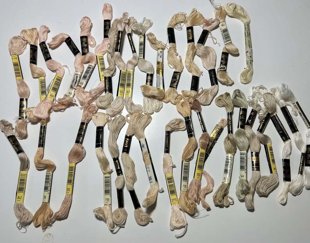 34 Skeins of assorted embroidery threads shades of beige, peach , white , tan